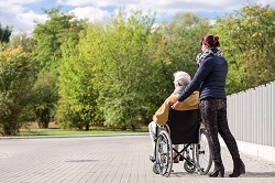 Caregiverwithdadinwheelchair