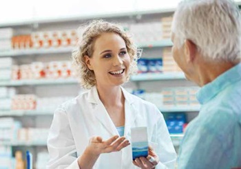 pharmacist talking to older man