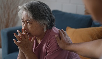 older woman looking worried or depressed