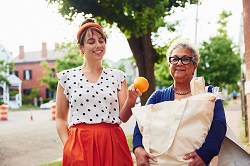 Two women walking outside